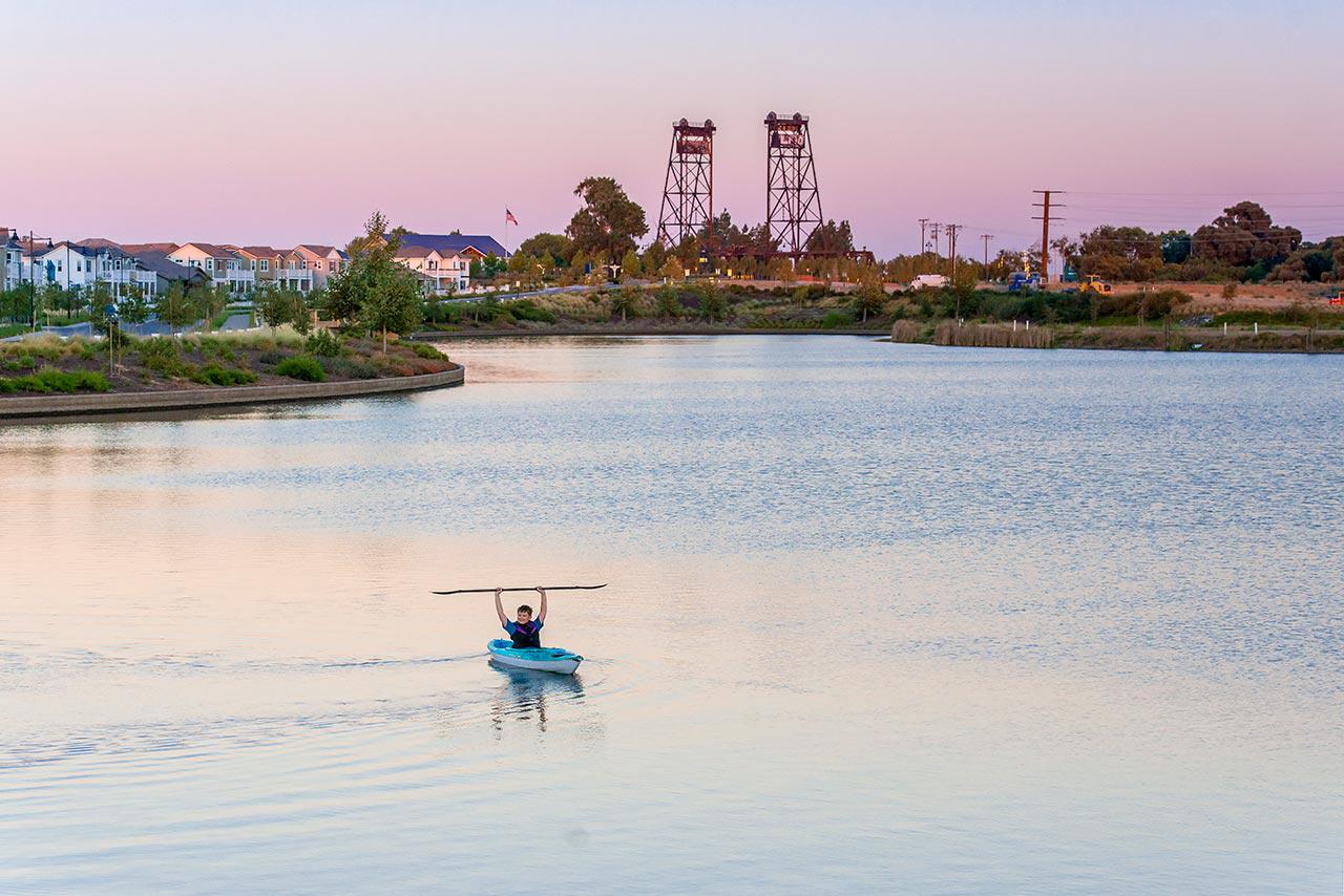 man kayaking on lake at river islands