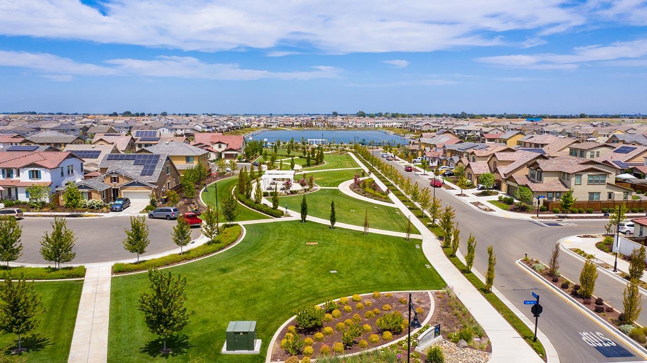 Summer House Park at River Islands in Lathrop with open fields and picnic table area