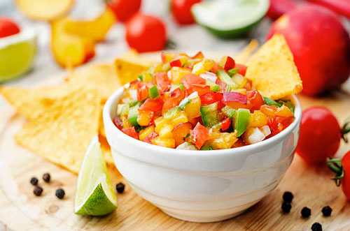 peach salsa in white bowl