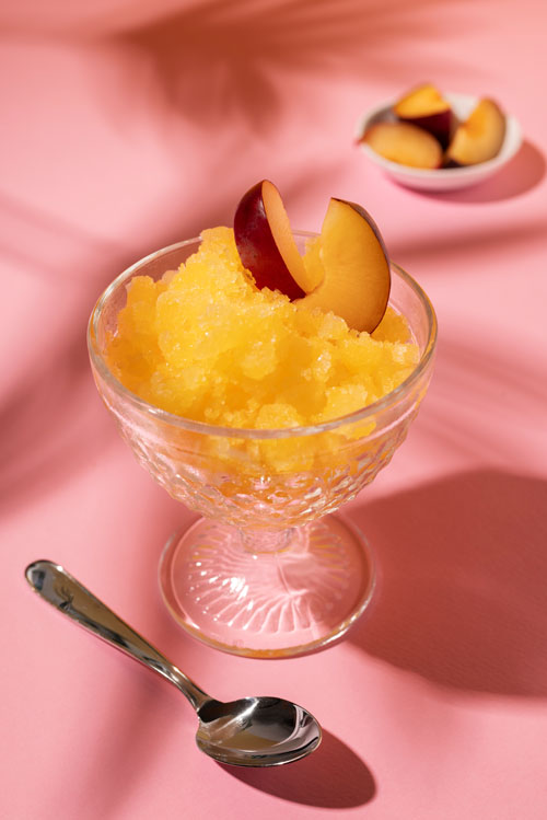 peach sorbet in glass bowl