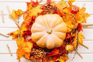 (pumpkin-in-a-leaves-wreath; 37.80226789590045, -121.32193629810645)