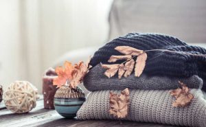 (pile-of-cozy-blankets-with-leaves; 37.80226789590045, -121.32193629810645)